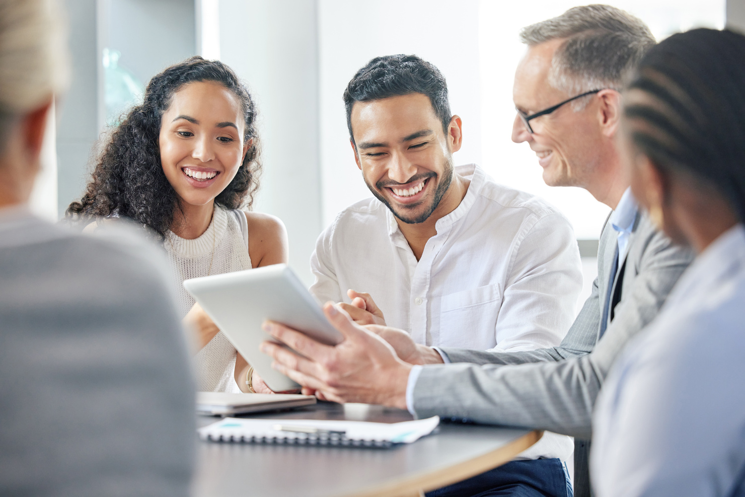 happy_business_people_and_meeting_with_tablet_in_office_for_communication_of_company_strategy